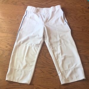 White baseball pants with blue piping on side